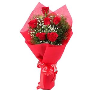 Pcs Thai Red Roses with color Tissue in a bouquet. Roses are imported from Thailand